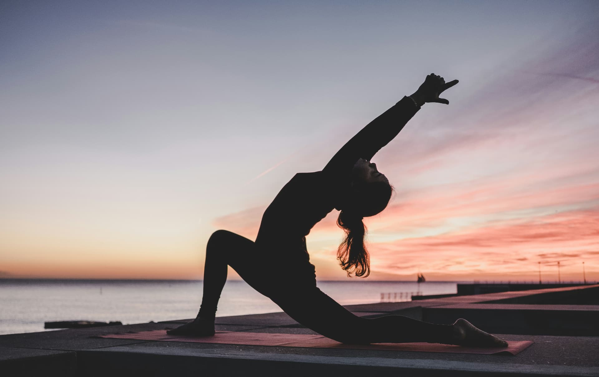 black and white photo of a woman doing yoga